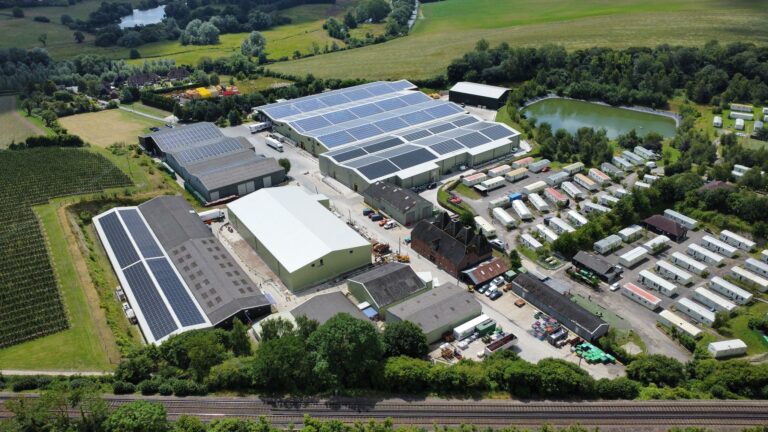 A drone shot of FW Mansfields which has solar panels installed on a collection of their buildings