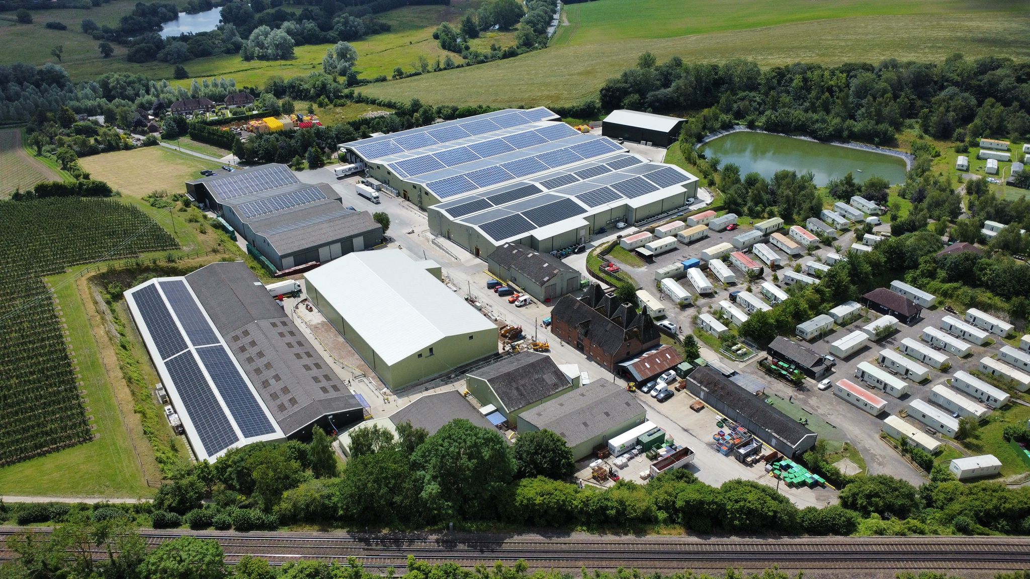 A drone shot of FW Mansfields which has solar panels installed on a collection of their buildings