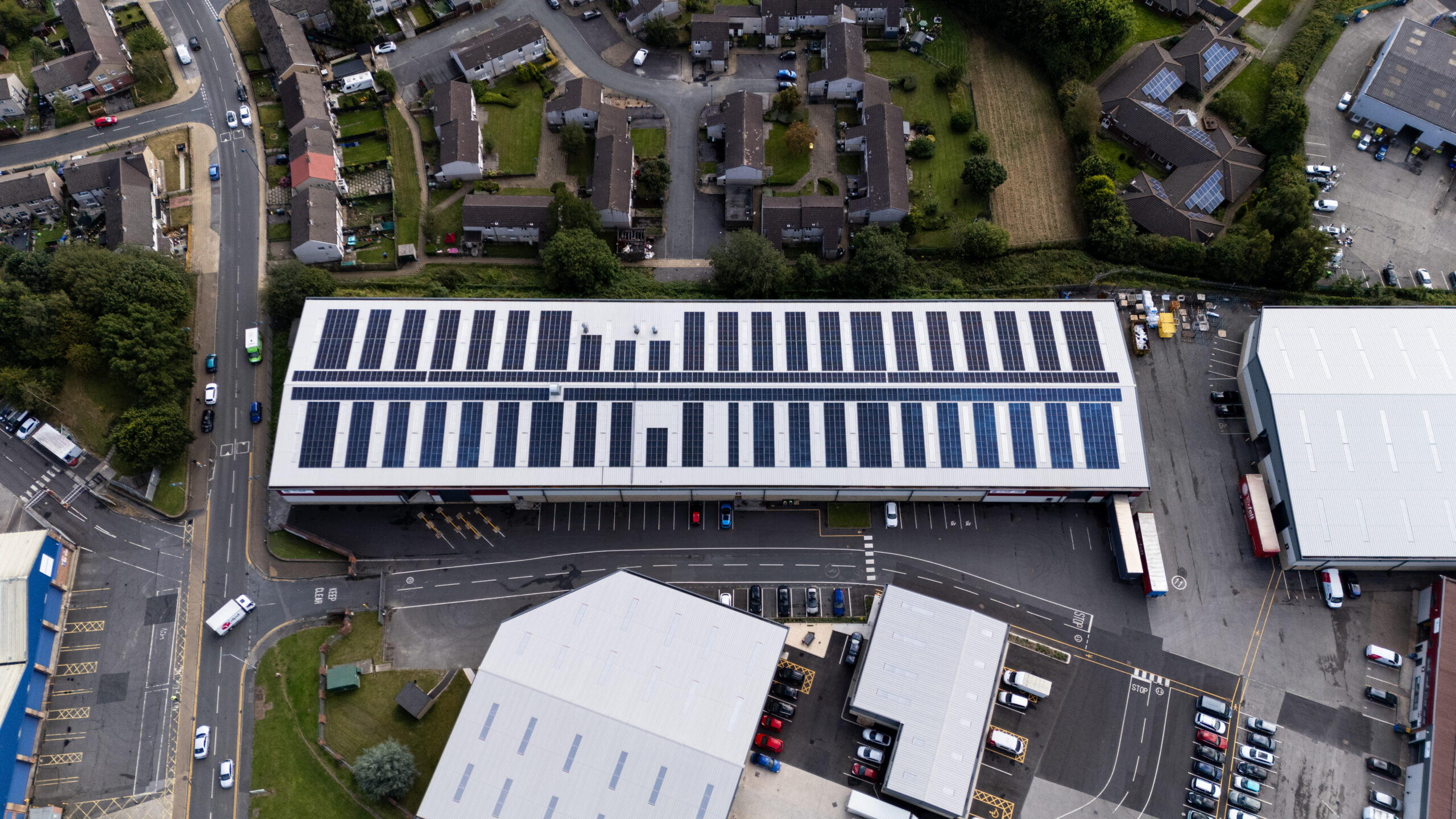 areal shot of commercial solar panels to show renewable energy for CSR
