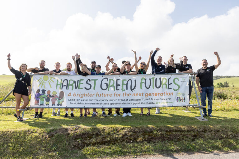 tHe team at harvest green developments behind a harvest green futures banner at the golf day